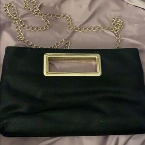 Black clutch with shoulder strap